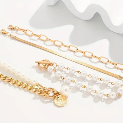 Set de pulseras de 4 piezas Chic Gold – Serpiente, perlas y eslabones | Oro